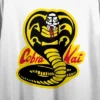 Cobra Kai Yellow And Black Cobra Women's White 21" Cropped T-shirt -Mizuno Shop GUEST 18ee8e7b adad 4545 b59a 8346df65e49c